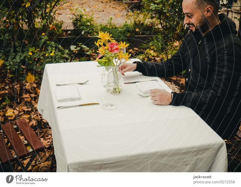 fine company | at table set with cut flowers laid table Man Feasts & Celebrations Decoration Bouquet Style Nature Cutlery Napkin tablecloth Anticipation Sit