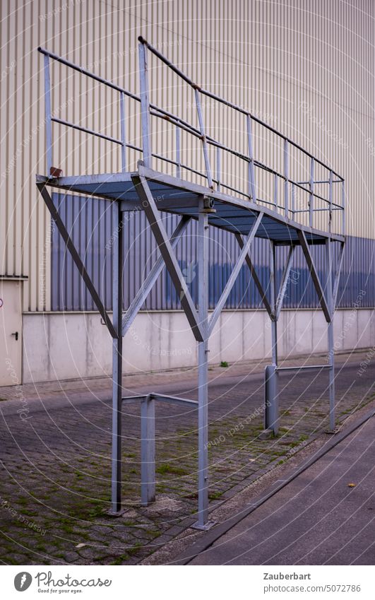 Scaffolding or platform in front of a warehouse building of an old inland port Platform Storage storehouses Steel Steel construction Construction Running track
