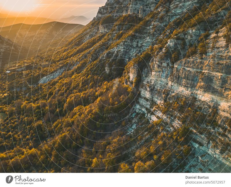 Autumn landscape in Les Trois Becs in Drôme provençale. The top limestone rocks is covered with autumn colors aerial view alps beautiful blue breathtaking