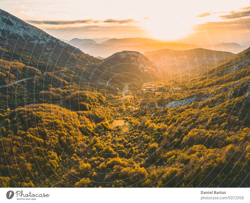 Autumn landscape at Les Trois Becs in Provence Drôme. Panoramic landscape of the valley during sunset. Limestone rocks covered with trees in autumn colors