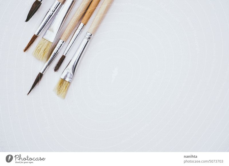 Clean and simple background of a white canvas with a mix of brushes mockup neutral texture art frame brown beige new clean variety stuff artist tools surface