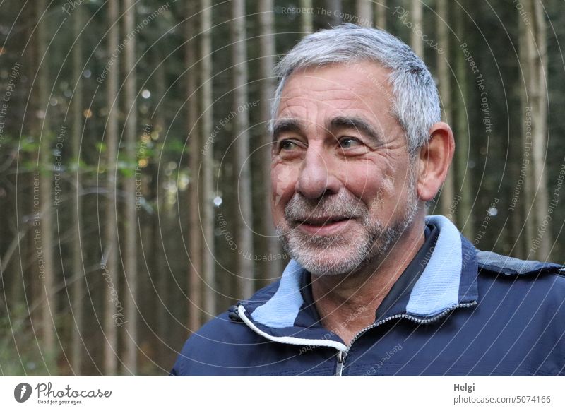 Portrait of smiling senior citizen with short gray hair and gray three day beard in nature Human being Man Senior citizen portrait Male senior