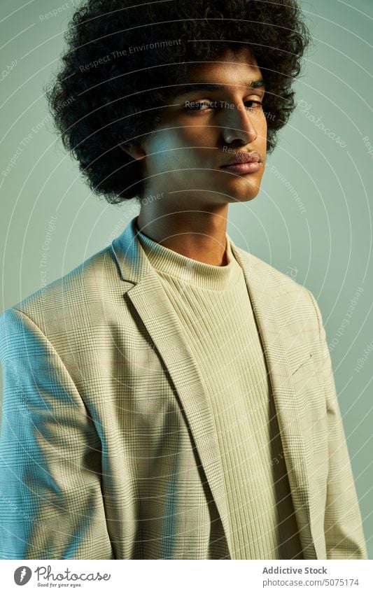 Stylish Hispanic man with Afro hairstyle suit afro model independent modern outfit character individuality male young hispanic ethnic smart casual curly hair