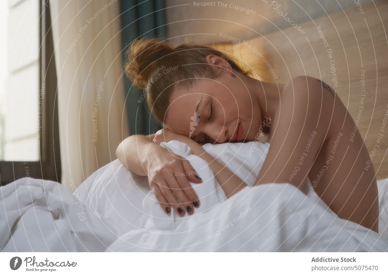 Woman relaxing on bed at early morning female bedroom sitting sensory perception human body beautiful woman sensuality beauty relaxation resting cozy