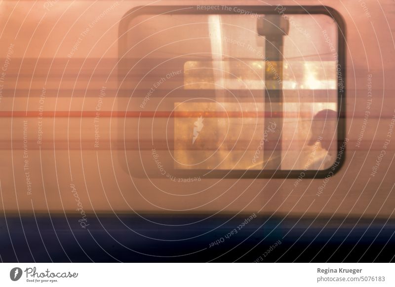 Silhouette of head with cap in window of moving train Train Track Train travel Rail transport Means of transport Public transit Commuter trains Colour photo