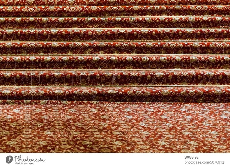 Some very wide steps are lined with a noble carpet stagger Stairs Carpet oriental Pattern Noble luxury luxurious Expensive Altar staircase Festive solemn Rich