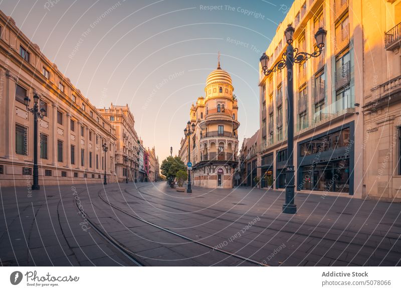 Central Seville building with dome on street in Spain central seville architecture exterior historic andalusia blue sky spain construction city facade morning