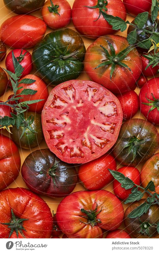 Fresh red ripe sliced tomatoes vegetable fresh food water healthy food nutrition natural organic vitamin tasty ingredient delicious drop kitchen chopping board