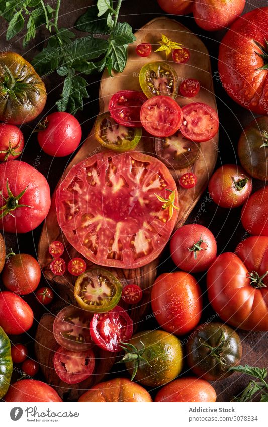 Fresh red ripe sliced tomatoes vegetable cutting board fresh food water healthy food nutrition natural organic salt vitamin tasty ingredient delicious drop