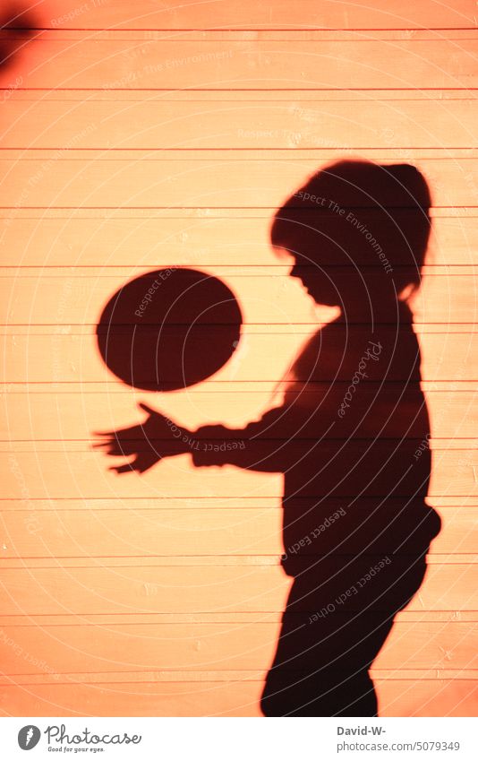 Silhouette of a child playing with a ball Shadow Child Playing free time Ball Joy Creativity creatively Infancy fun Happiness Leisure and hobbies Girl