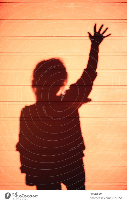 silhouette of child pointing and raising hand Silhouette Freedom of expression Child Girl Pipe up Shadow play creatively Volunteer me raise your hand Light