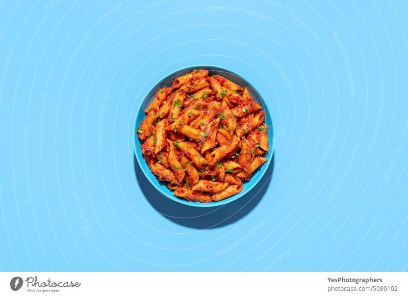 Penne in tomato sauce, top view on blue background Above Arrabbiata Blue Bowl Bright Carbohydrates Chili Classic Colour seethed Copy Space creatively Kitchen