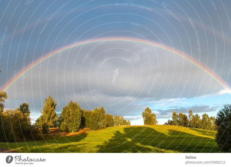 Rural landscape with double rainbow, autumn day after rain colorful landscapes rural countryside sunlight summer scene view latvia beauty beautiful nature field