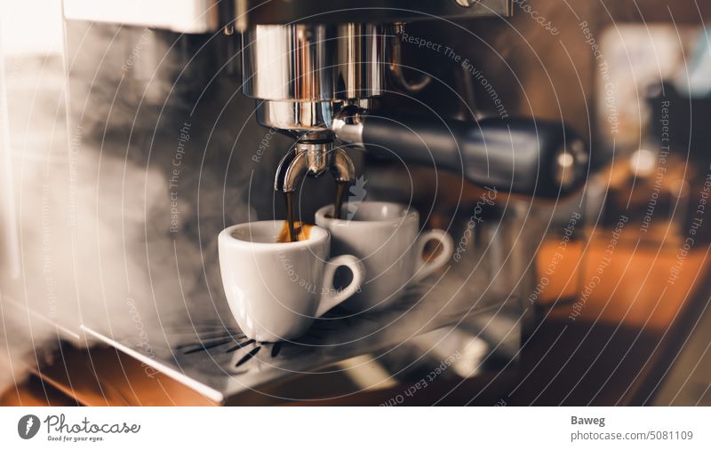 Portafilter machine pours fresh coffee into espresso cups portafilter portafilter machine steam cappuccino coffee maker coffee cup appliance aroma background