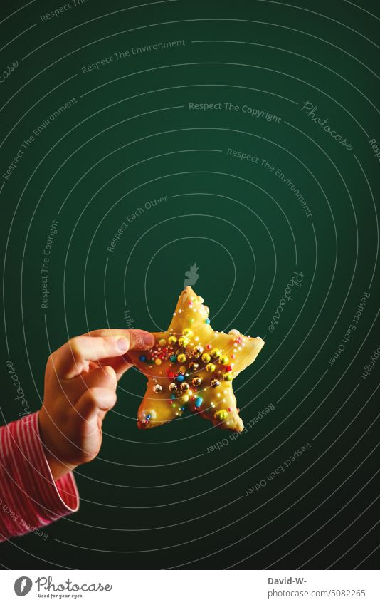 Christmas cookies in the hand of a child Christmas & Advent Cookie Stars Child Christmas baking Anticipation Decoration Christmas decoration Christmas star