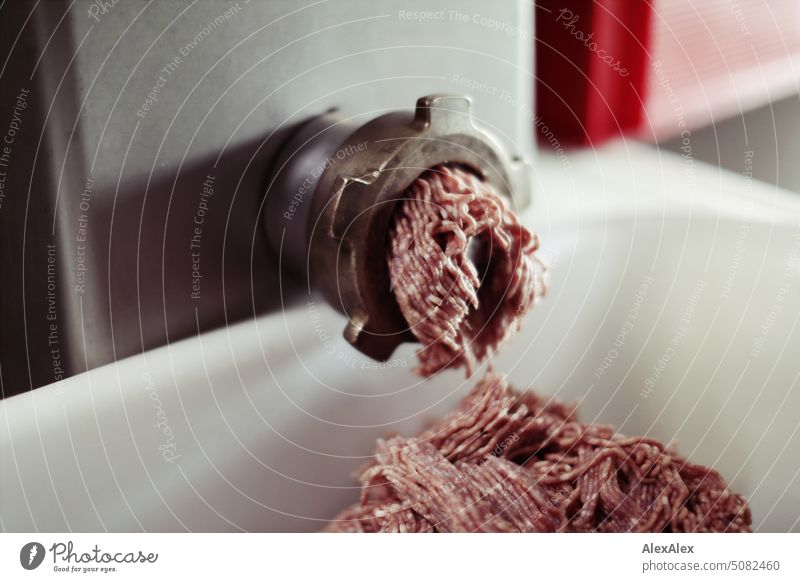 Meat grinder from which minced meat swells into a white when - sausage making. Machinery Craft (trade) butcher Butchery Production handicraft production hack