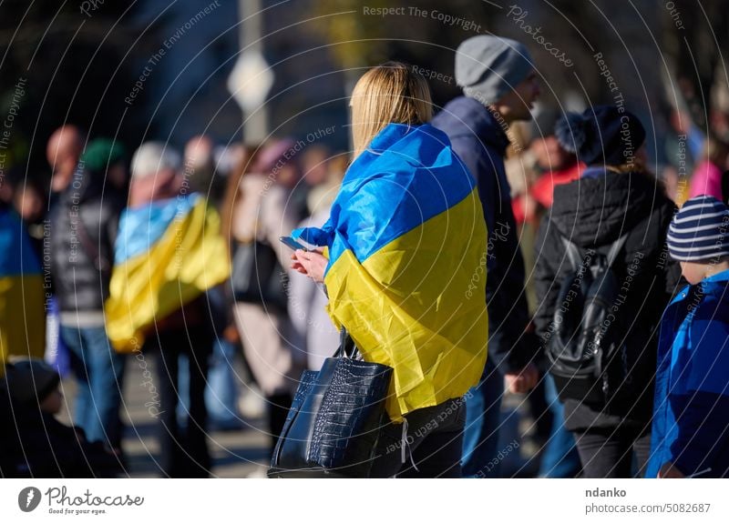 Ukraine, Kherson - November 14, 2022: Crowd of people with Ukrainian flags on the streets of liberated Kherson, deoccupation celebration adult city country
