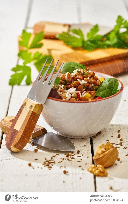 Healthy salad in bowl with knife and fork vegetable healthy food nut bench vegetarian walnut assorted kitchen fresh wooden natural utensil organic delicious