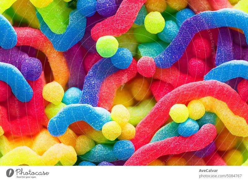Many rainbow candies random bright and sugary background. Colorful sprinkles. Decoration for cake and bakery. colourful candy sweet many treat dessert flavor
