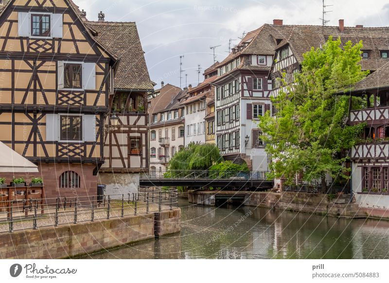 Idyllic waterside impression around a district named Petite France in Strasbourg, a city at the Alsace region in France alsace petite france old town ill