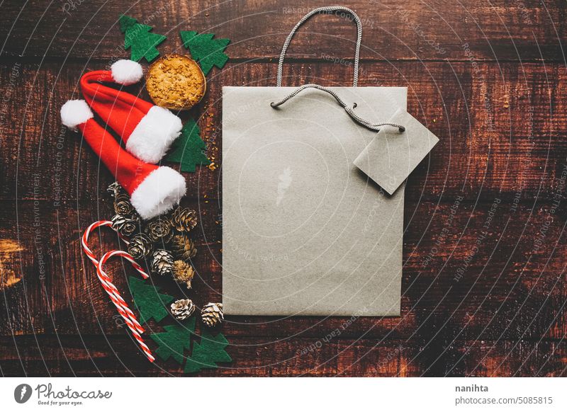 Christmas mockup with a gift bag surroundid by classical christmas decoration wooden flat lay texture flatlay traditional decorative pine cone tree candy
