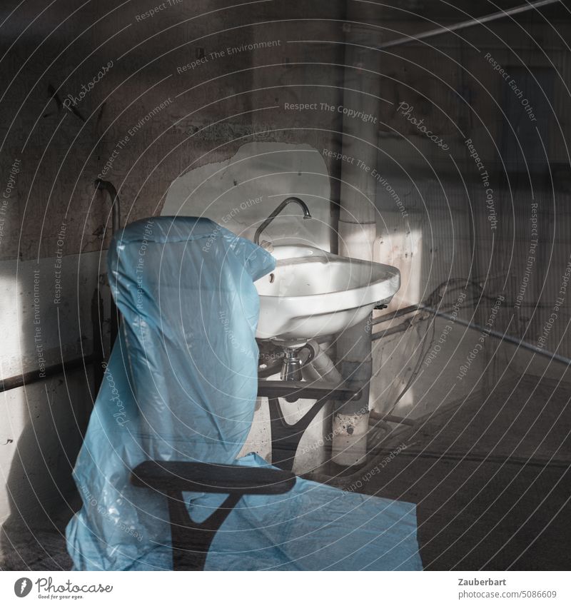 Desk chair, covered with plastic bag, in front of sink, creates eerie impression of cloaked person Chair shrouded Plastic bag plastic sack Sink felonies Kidnap