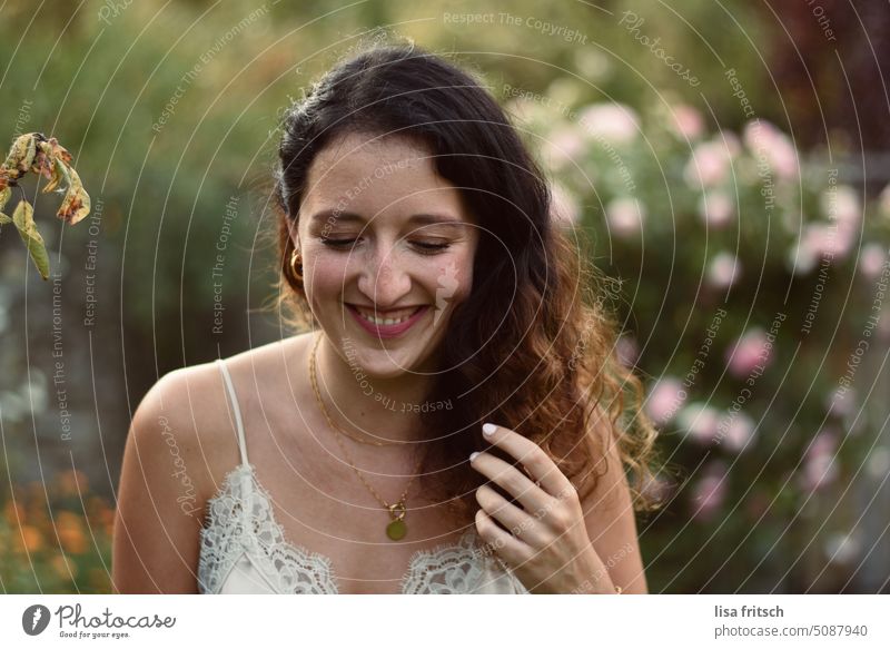 WOMAN - LAUGHTER - SUMMER - CURLS Woman Curl Brunette Downward pretty youthful Young woman 25-29 years Nature Esthetic naturally fortunate Colour photo