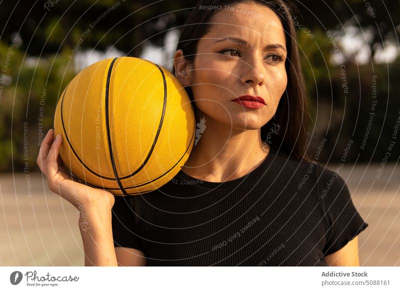 Sportswoman playing basketball on court throw streetball game training hobby sport practice sporty active sportswoman energy determine athlete hoop motivation