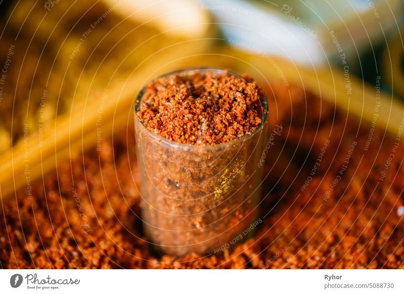 Close-Up Glass Of Red Ground Aromatic Spice Mixture With Salt Addition On Sale At East Market Bazaar mixture popular ground flavor nobody cuisine salt aroma