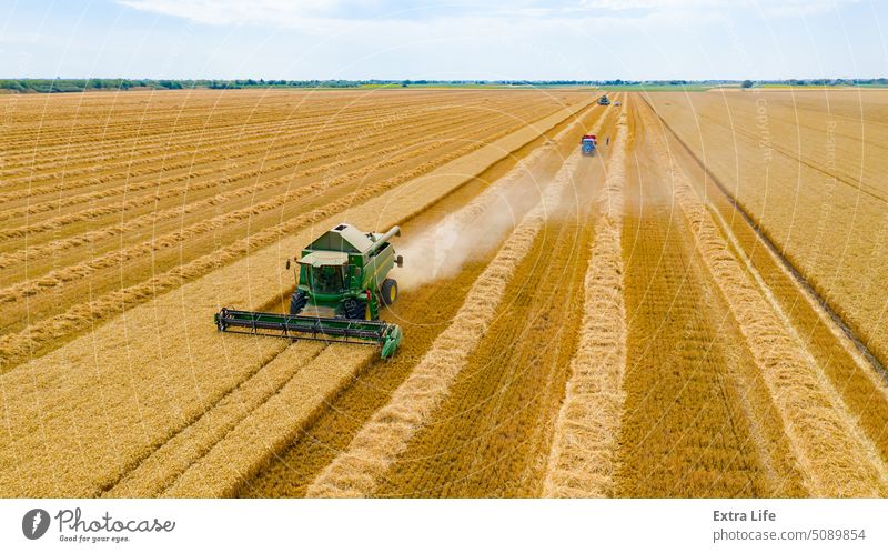 Above view on combine, harvester machine, harvest ripe cereal Aerial Agriculture Cereal Combine Country Crop Cultivation Cut Dry Dust Dusty Farming Farmland