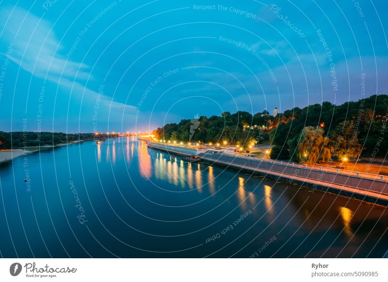 Scenic Evening View Of Sozh River, Illuminated Embankment, Park, Cathedral In Gomel Homiel, Belarus landmark nobody cathedral embankment yellow greenwood blue