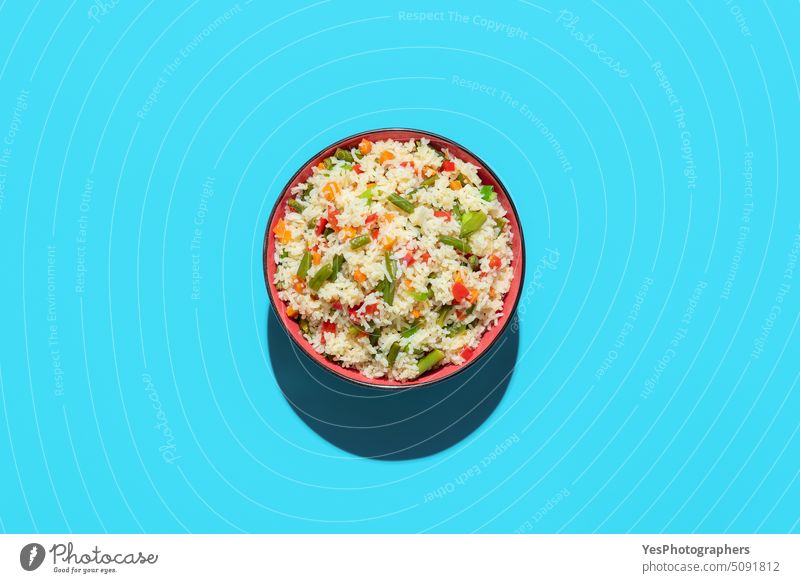 Fried rice bowl above view on a blue background asian beans bright carrot chinese color cooking copy space cuisine cut out delicious design diet dinner dish