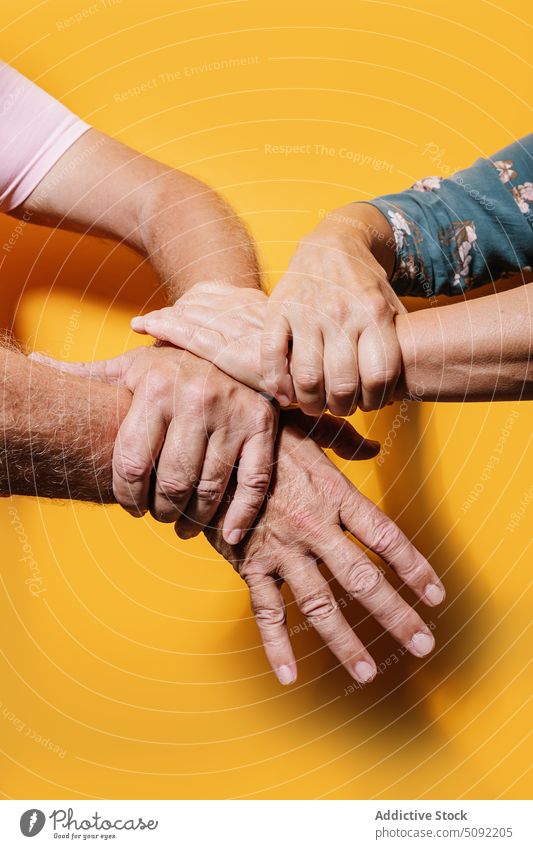 Crop old people holding hands touch love relationship close support unity aged gesture trust solidarity equal bonding group tender harmony studio shot gentle