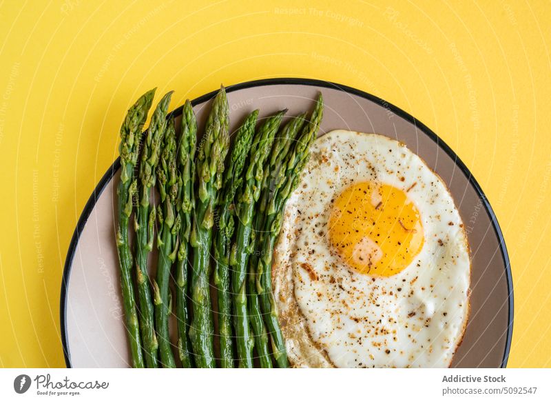 Top view of fried egg with asparagus breakfast lunch healthy food meal top view fresh diet delicious vegetable cooking appetizer dinner green cuisine dish