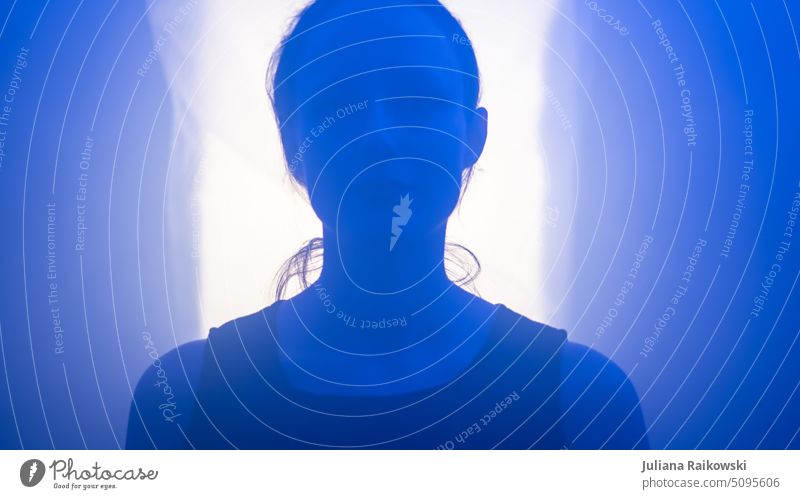 Outline of a young woman in blue light Blue chill pretty outline No face Lifestyle Artistic Style Esthetic Elegant melancholy Interior shot Mysterious