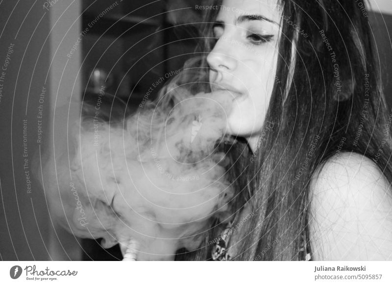 young woman smoking shisha in black and white smoke shisha Smoke Smoking Nicotine Tobacco Waterpipe Hookah Exotic oriental Healthy Health hazard e-zigarette