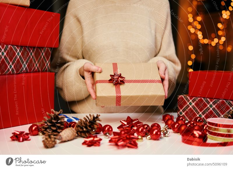 Woman holding gift box in hands. Surprise for winter holidays present woman surprise happy background christmas new year festive celebration decoration birthday