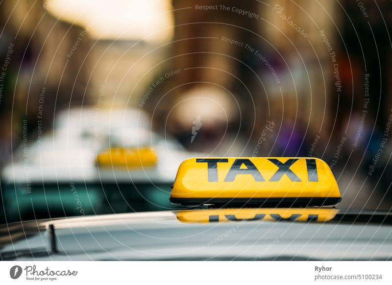 Taxi Sign On Roof Of Car auto logotype transportation roof town nobody copy space street cab city title concept vehicle yellow taxi public outdoor signboard car