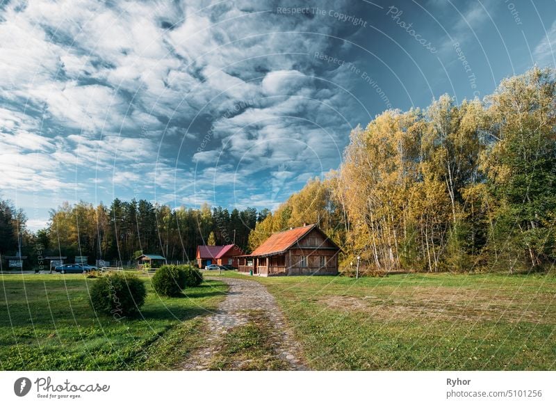 Berezinsky, Biosphere Reserve, Belarus. Traditional Belarusian Tourist Guest Houses In Autumn Landscape. Popular Place For Rest And Active Eco-tourism In Belarus