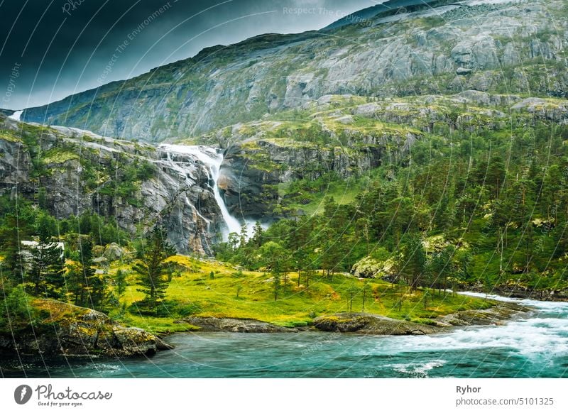 South Fjord, Norway. Giant Waterfall In Valley Of Waterfalls. Husedalen Waterfalls Were A Series Of Four Giant Waterfalls In South Fjord national tall flow