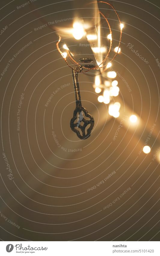 Magical background image of an old key surrounded by christmas lights secret bokeh abstract vintage retro antique mystery mysterious reflection blur blurry