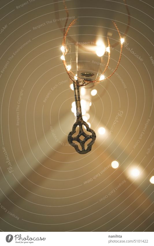 Magical background image of an old key surrounded by christmas lights secret bokeh abstract vintage retro antique mystery mysterious reflection blur blurry