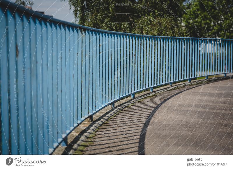 steep curve rail Blue Perspective Curve Structures and shapes Upward Lanes & trails Shadow Shadow play Line Pattern Traffic infrastructure Asphalt Deserted