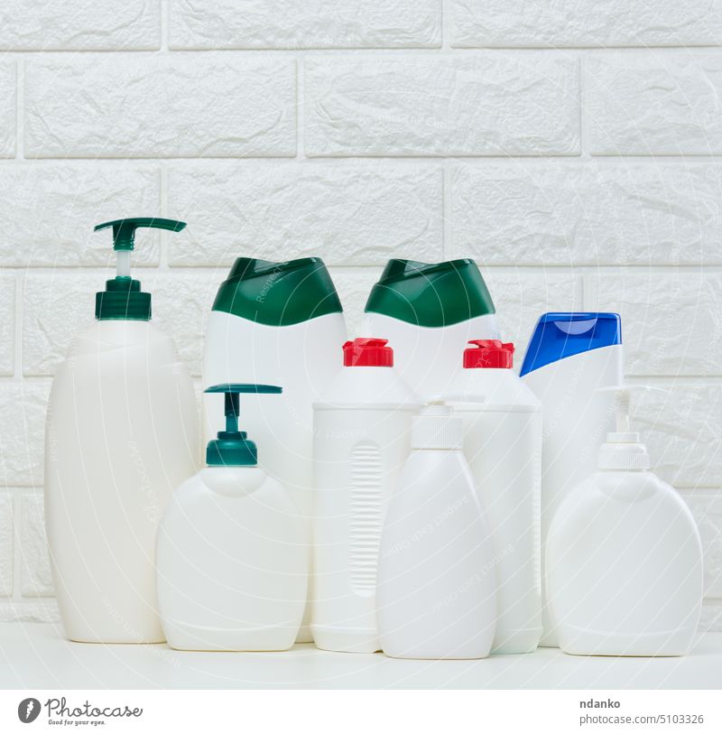 Empty plastic white bottles for cosmetics and other liquid substances on a white background. brand care package product pump detergent dispenser domestic
