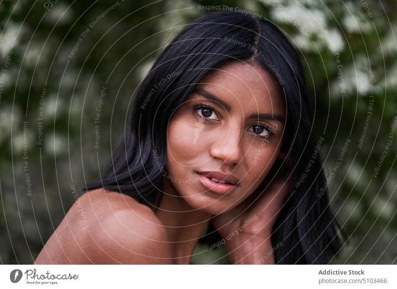 Friendly black female looking at camera woman smile park friendly lush foliage happy summer weekend portrait young ethnic glad bare shoulders optimist daytime