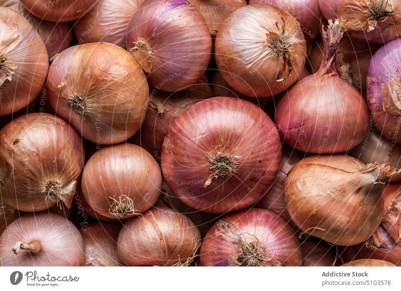 Assorted unpeeled onions in market assorted raw background fresh vegetable healthy food uncooked many grocery gastronomy nourish shape vegetarian season set