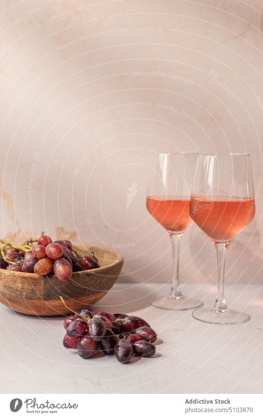 Glasses of wine with fruits on table glass drink bowl grape fig serve food slice red beverage tasty vitamin delicious fresh ripe nutrition organic yummy