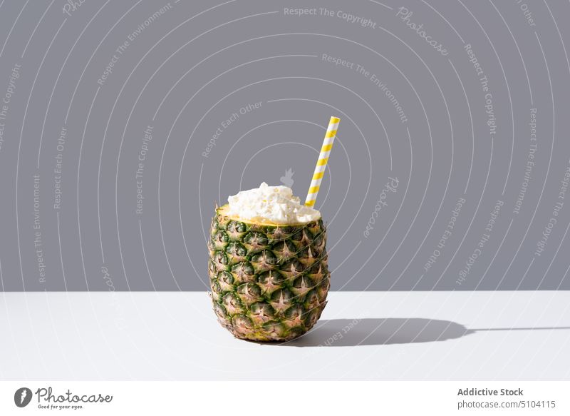 Fresh pineapple with straw on table healthy drink tropical cream concept sunlit fresh juice fruit vitamin natural organic exotic ingredient vegan sweet beverage