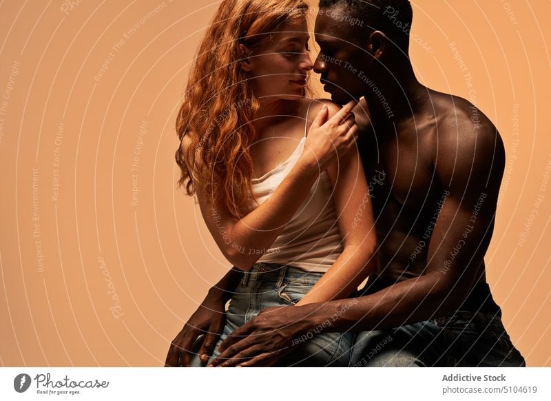 Loving multiethnic couple embracing in studio boyfriend girlfriend tender embrace hug relationship face to face fondness love in love together african american