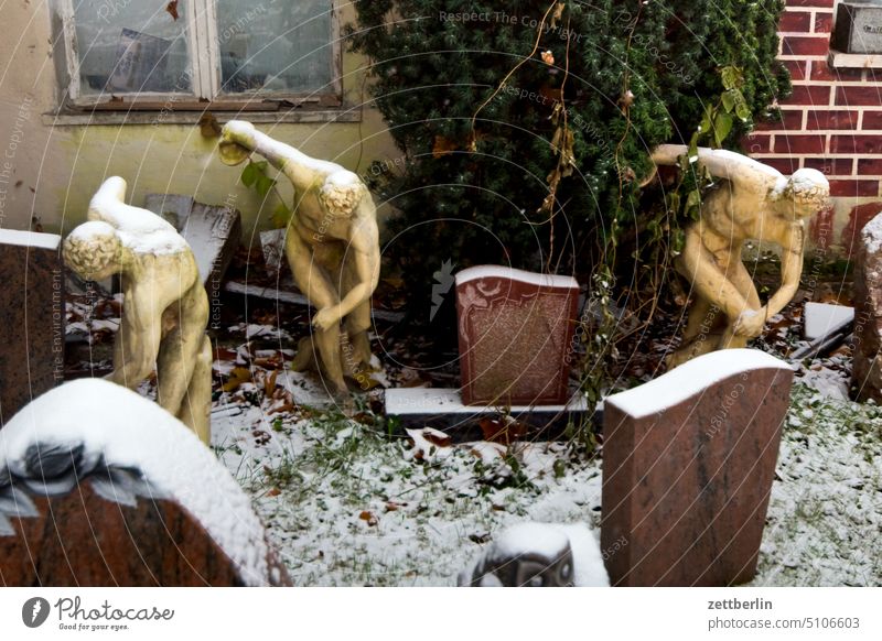 Discus thrower at stonemason in winter Selection Cemetery Grave Tombstone assortment Snow Virgin snow Winter grave sale Pattern sample exhibition Exhibition